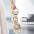 Hand holding a portable fan with a blurred indoor background