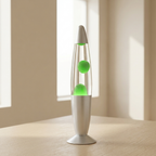 Lava lamp with green liquid on a wooden surface