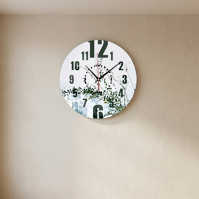 Round wall clock with floral design on a beige wall