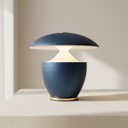 Modern blue table lamp on a neutral background