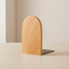 Wooden bookend on a beige surface with a neutral background