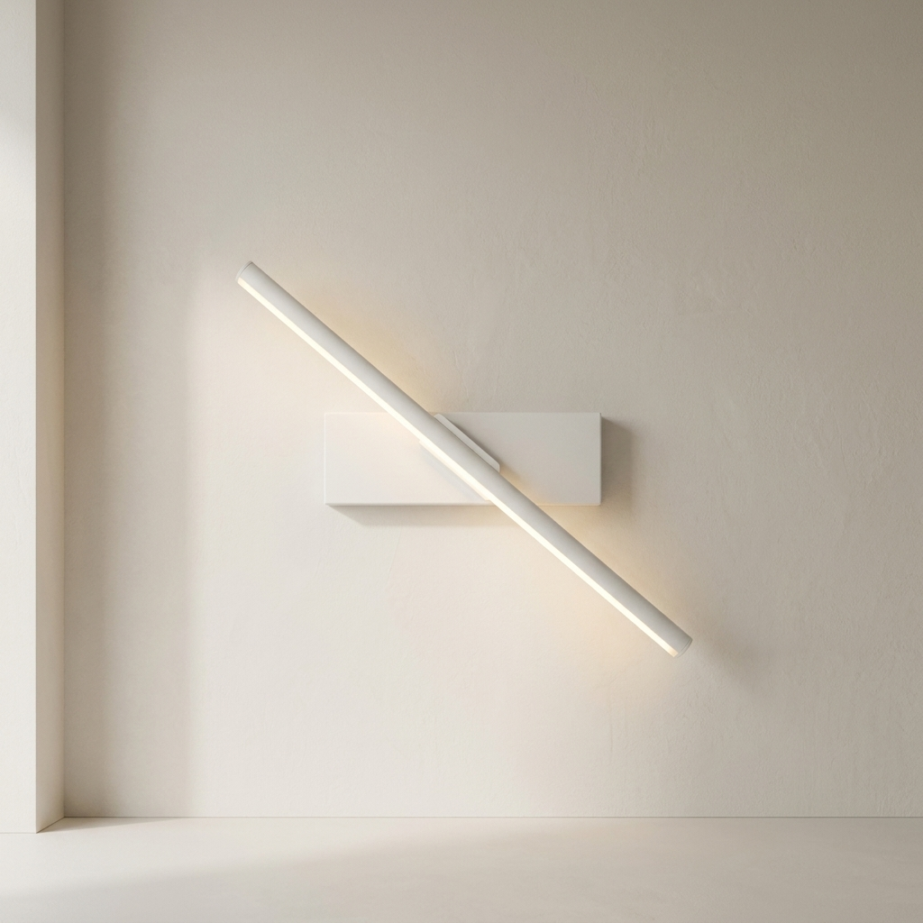 A modern minimalist wall sconce with a long cylindrical light bar mounted on a rectangular base, shown illuminated against a warm beige wall.
