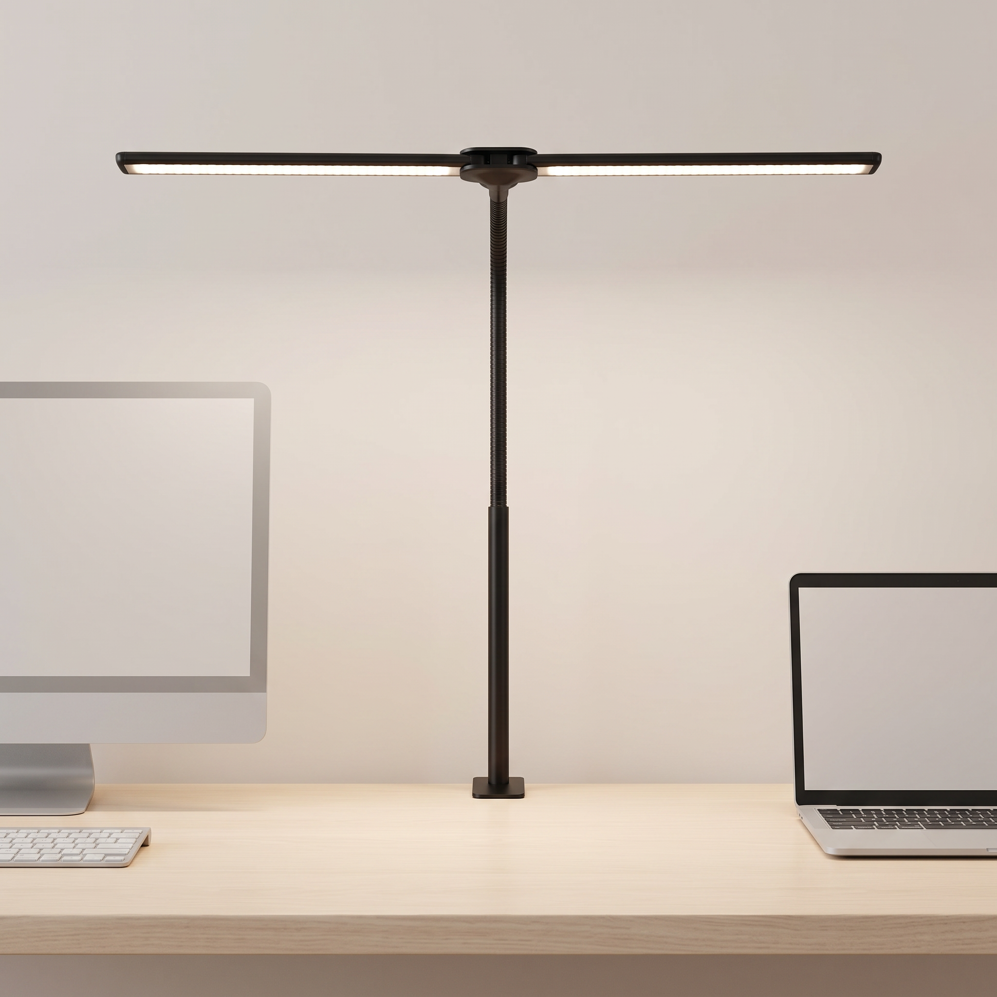 A modern black adjustable desk lamp with a horizontal bar and slim stand, illuminated on a light wood desk with a computer monitor on the left and a laptop on the right.