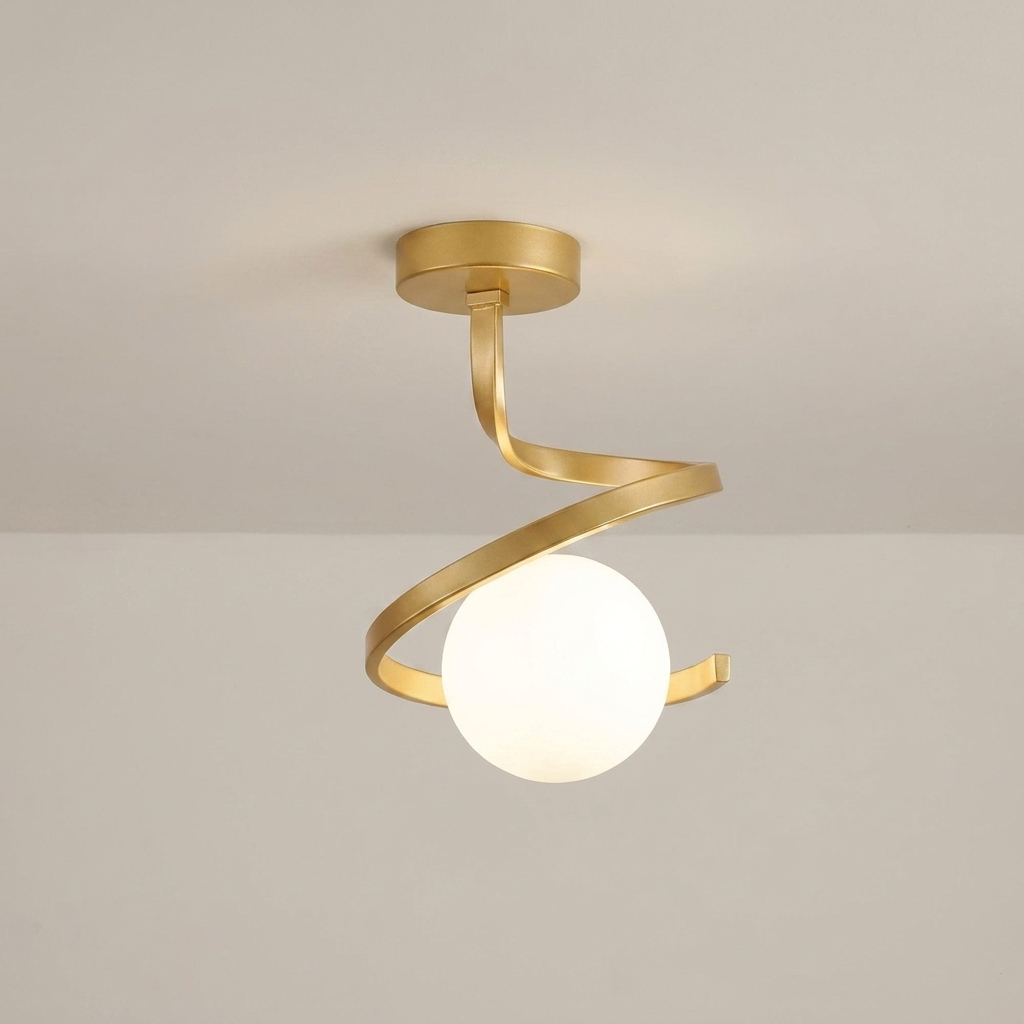 A modern semi-flush mount ceiling light fixture with a brushed gold spiral metal frame and a glowing white frosted glass globe, shown against a neutral off-white ceiling.