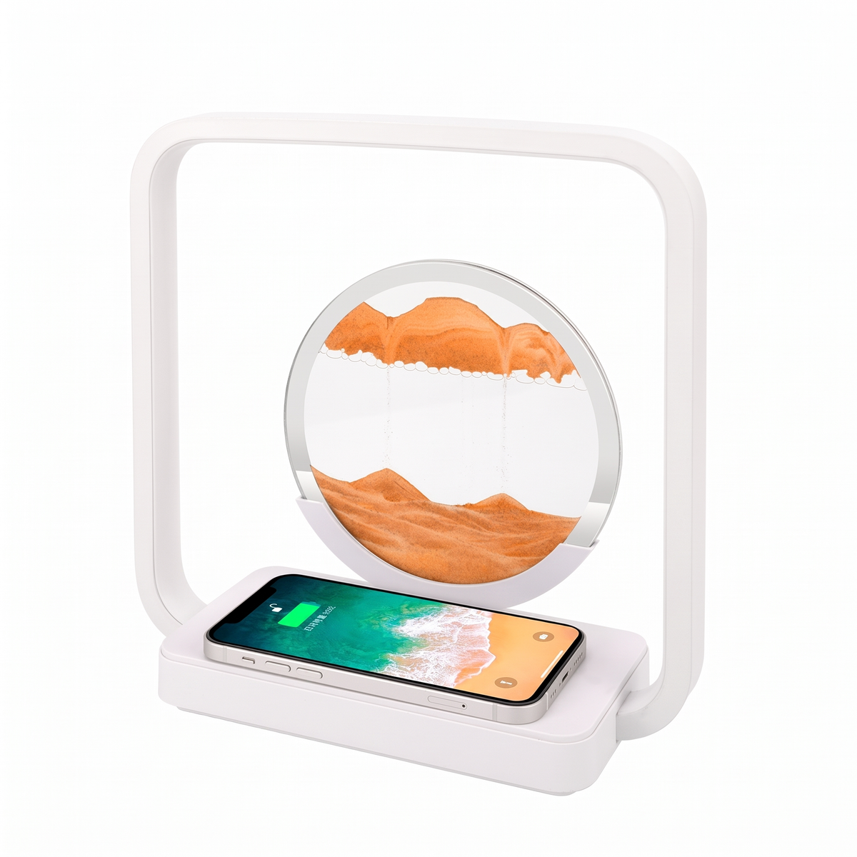A white magnetic levitation sand clock lamp with a smartphone resting on its charging base, set against a clean white background.