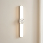 Modern wall-mounted light fixture on a neutral wall