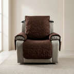 Brown quilted chair cover on a gray recliner chair in a room with light-colored walls and carpet.