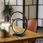 Modern table lamp with circular design on a wooden surface