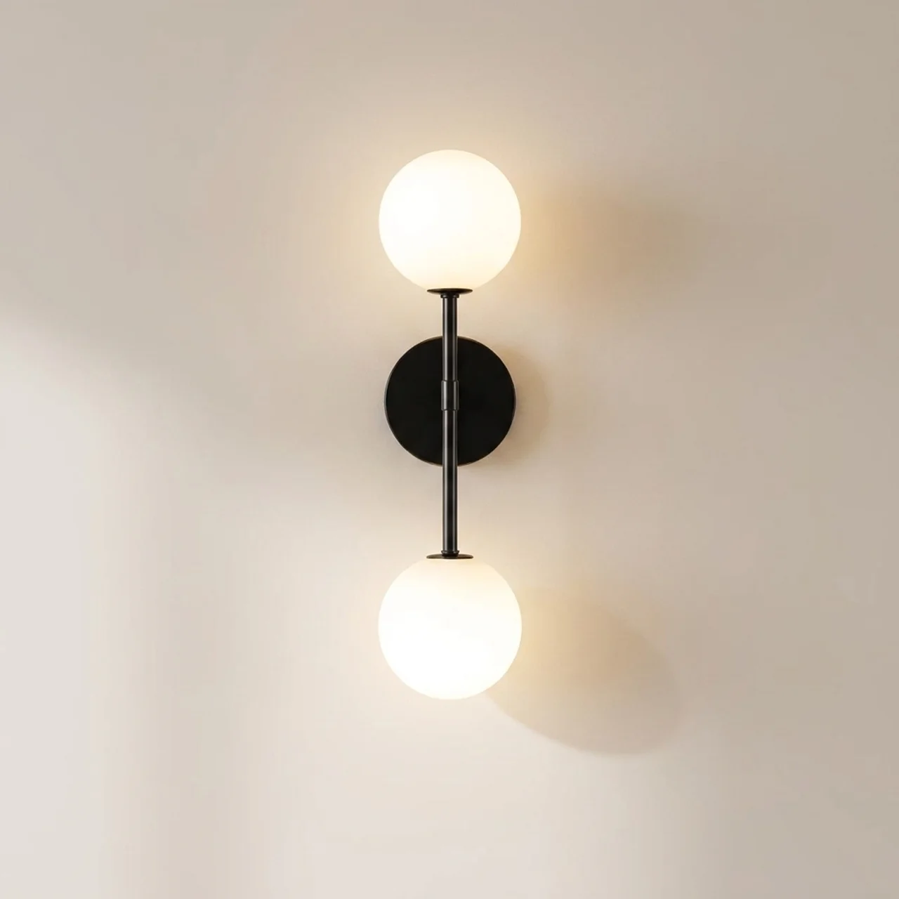 Wall-mounted lamp with two round lights on a plain wall