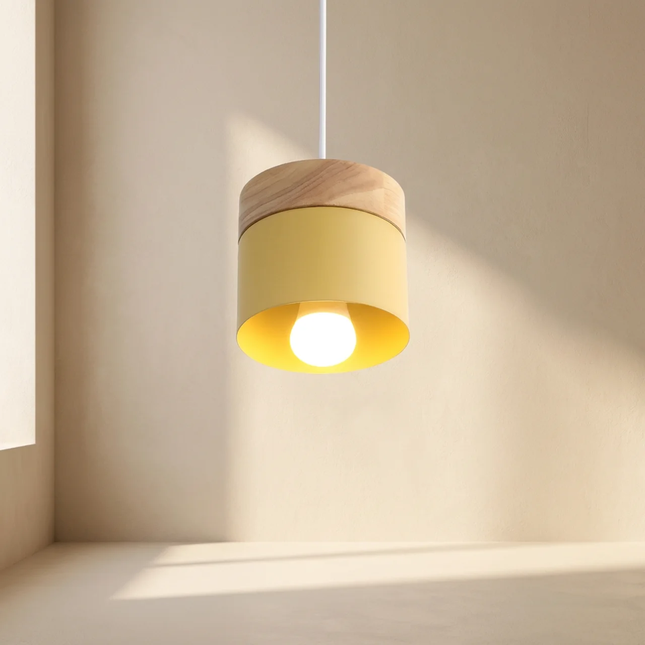 Yellow pendant light with wooden shade on a neutral wall