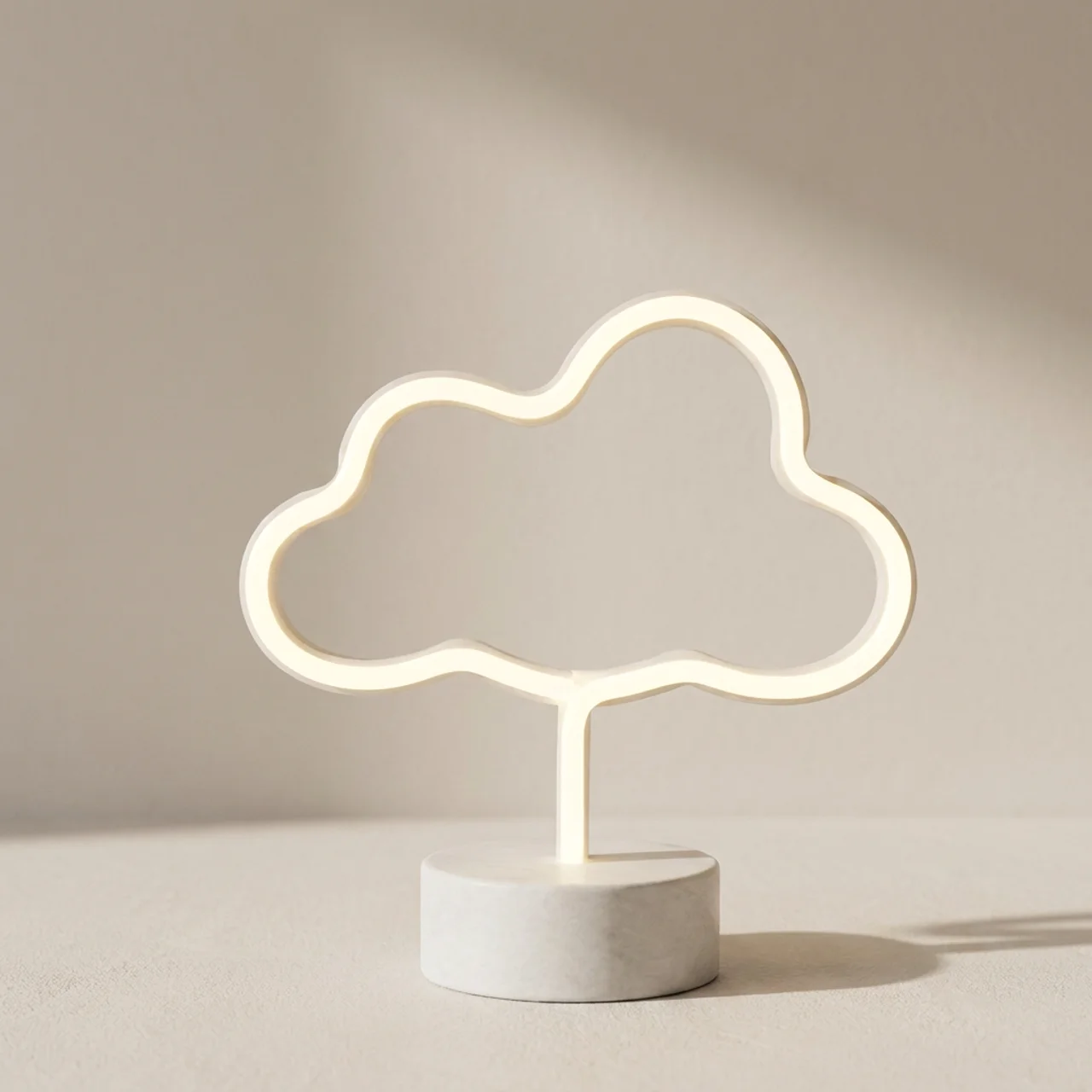 Cloud-shaped LED lamp on a neutral background