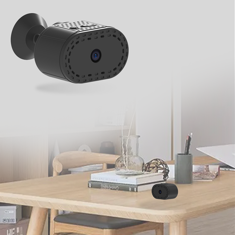 Small black camera on a wooden table with text indicating its use as an indoor camera.