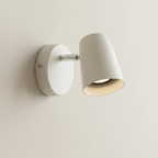 White wall-mounted lamp on a plain background