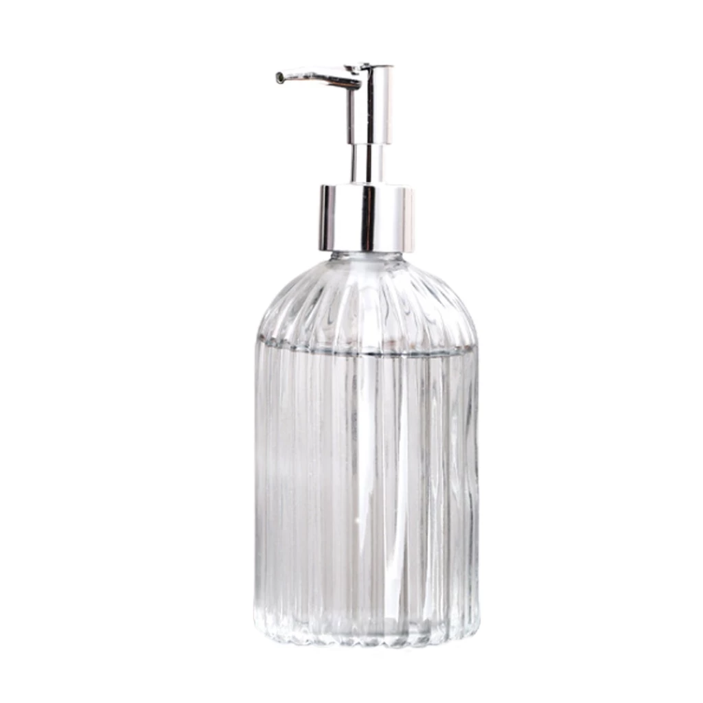 Clear glass soap dispenser with silver pump on a white background