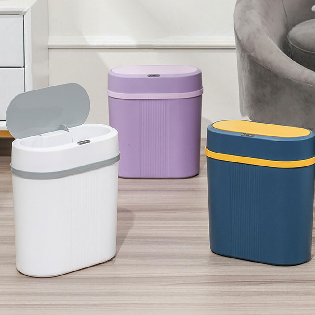 Three colorful trash cans on a wooden floor with a neutral background