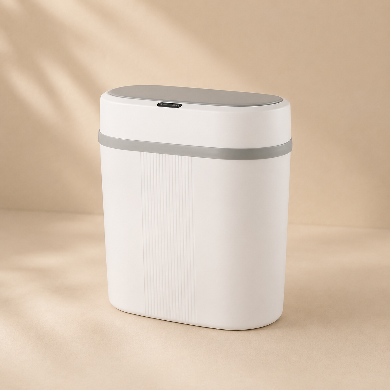 White trash bin with gray lid on a beige background
