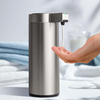 Hand soap dispenser being used with a blurred background