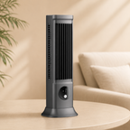 Gray tower fan on a beige surface with a blurred background