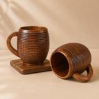 Two wooden mugs with textured design on a beige background