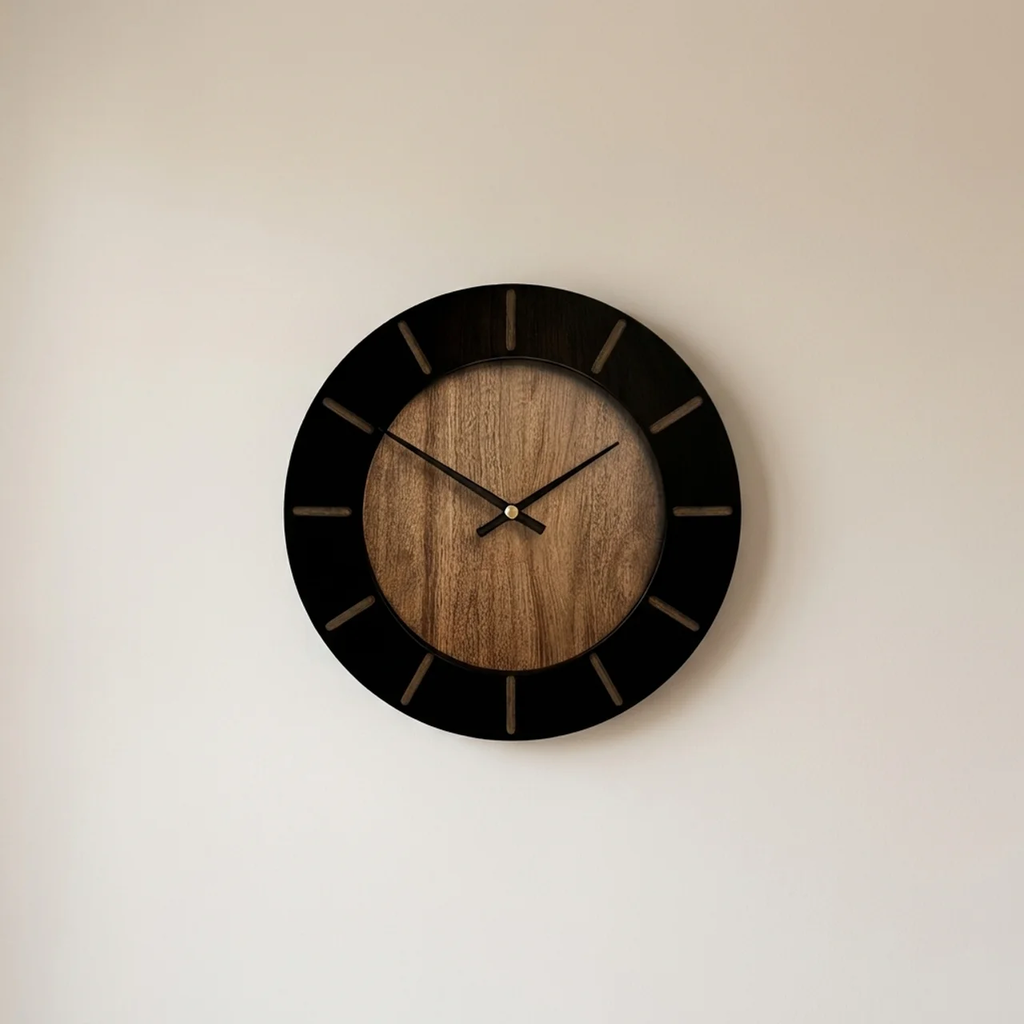 Wooden wall clock with black frame on a beige wall