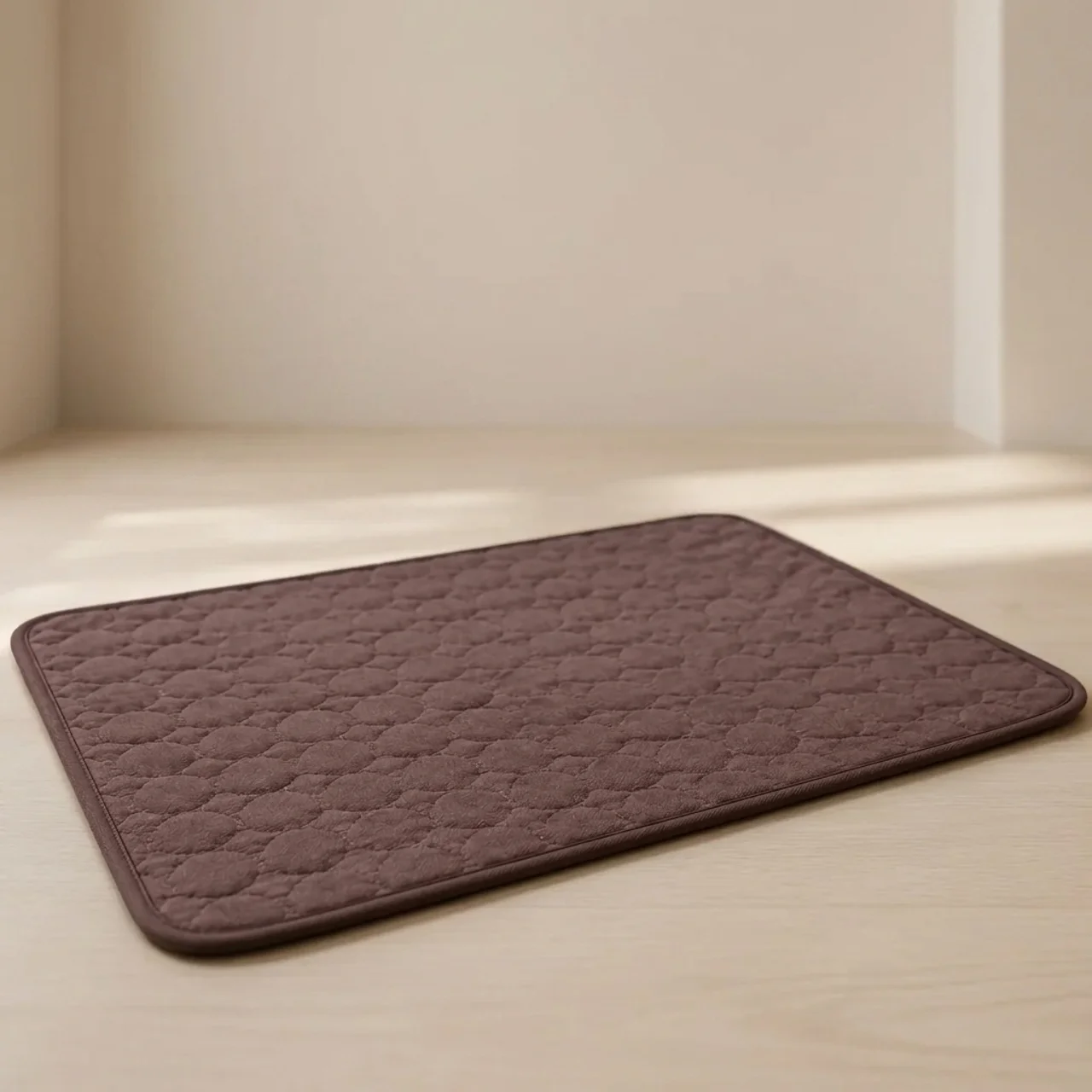 Brown bath mat on a light wooden floor