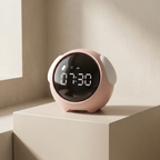 Pink digital clock on a light surface with a neutral background