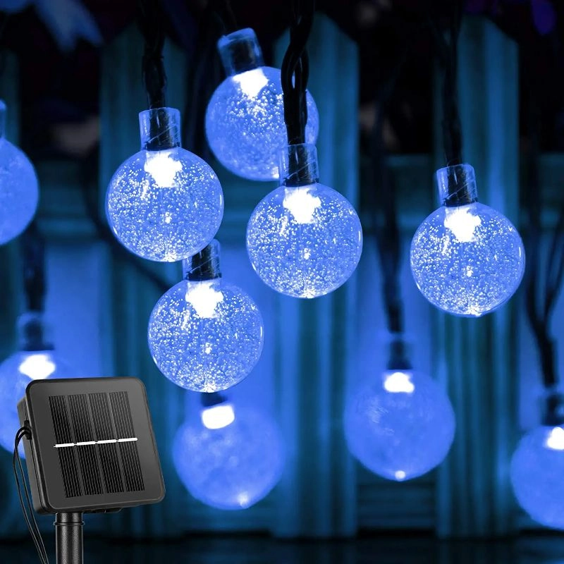 String of blue LED lights with a solar panel power source on a dark background