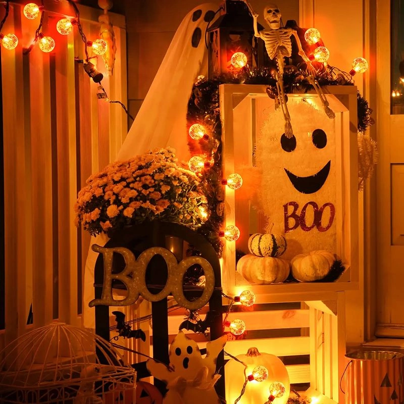 Halloween-themed decorations with pumpkins, ghosts, and a smiling jack-o'-lantern sign.