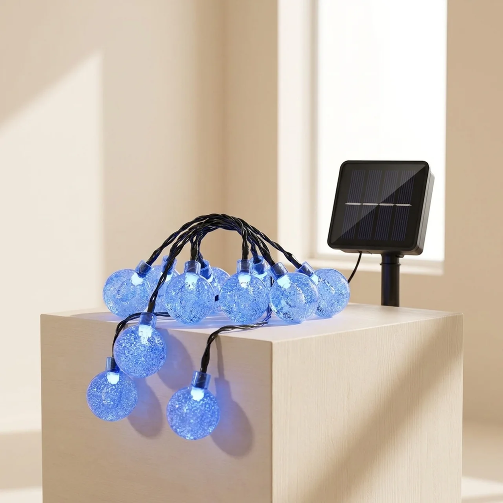 Blue string lights with solar panel on a beige surface