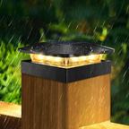 Solar-powered outdoor light fixture on a wooden post with rain in the background