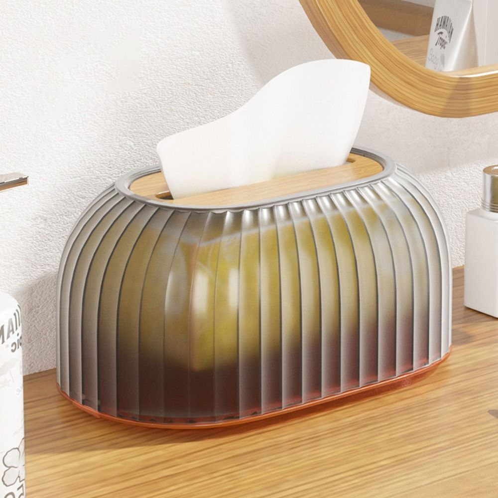 Decorative tissue holder with tissues on a wooden surface