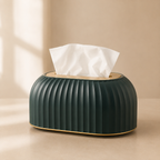 Green tissue box with white tissues on a beige background