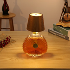 Decorative lamp with brown shade on a wooden surface