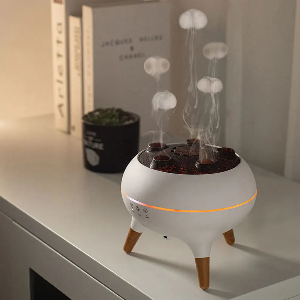 White diffuser with wooden legs on a surface, emitting mist.