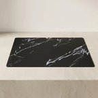 Black marble-patterned mat on a light gray surface