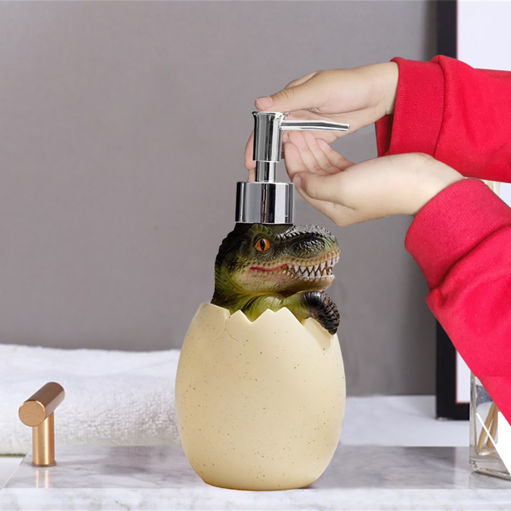 Dinosaur-themed soap dispenser with a person using it on a bathroom counter.