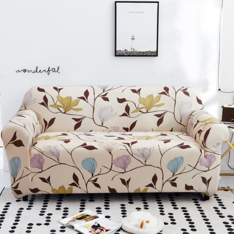 Floral patterned sofa cover on a beige sofa in a living room setting.