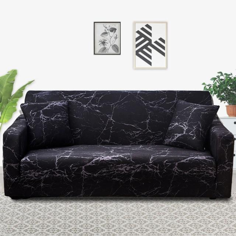 Black marble-patterned sofa cover on a couch in a living room setting with plants and wall art.