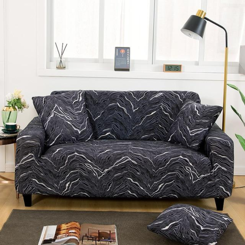 Sofa with a dark gray and white pattern in a living room setting.