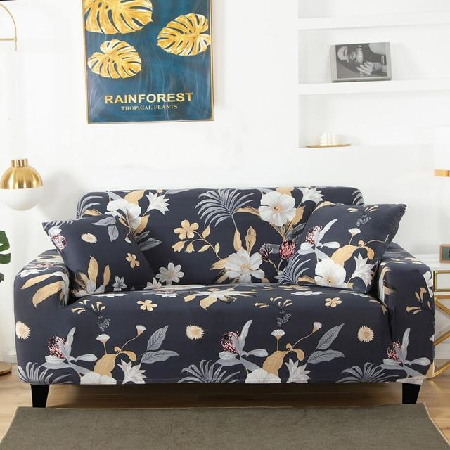 Floral patterned sofa cover on a couch in a living room setting with a 'Rainforest' poster in the background.