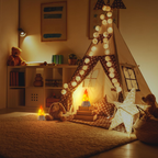 A cozy children's play teepee set up in a warmly lit nursery or playroom. The teepee is decorated with string lights, patterned fabric panels, and a window cutout, with a glowing campfire decoration inside.