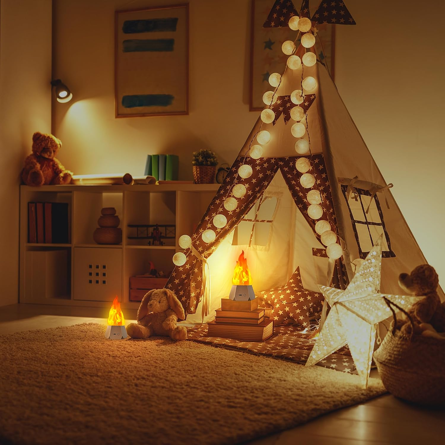 A cozy children's play teepee set up in a warmly lit nursery or playroom. The teepee is decorated with string lights, patterned fabric panels, and a window cutout, with a glowing campfire decoration inside.