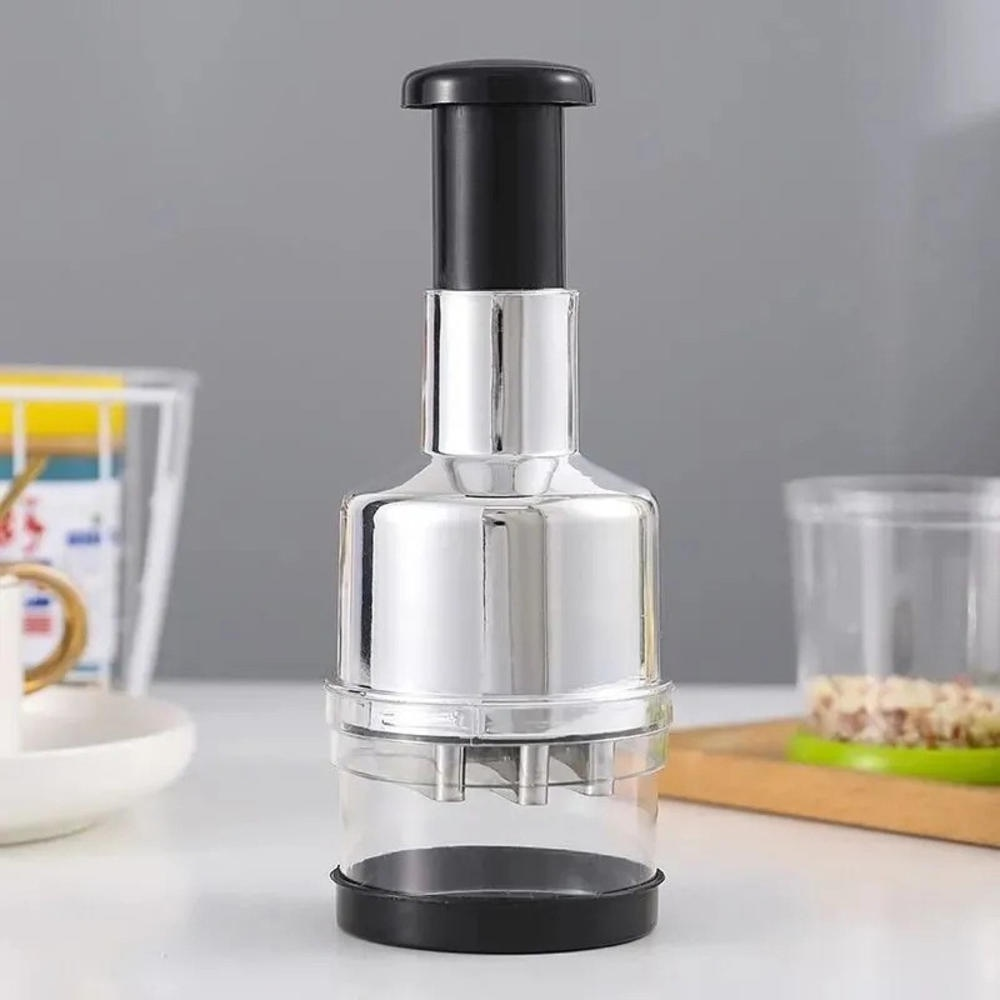 Clear kitchen tool with black top and bottom on a neutral background