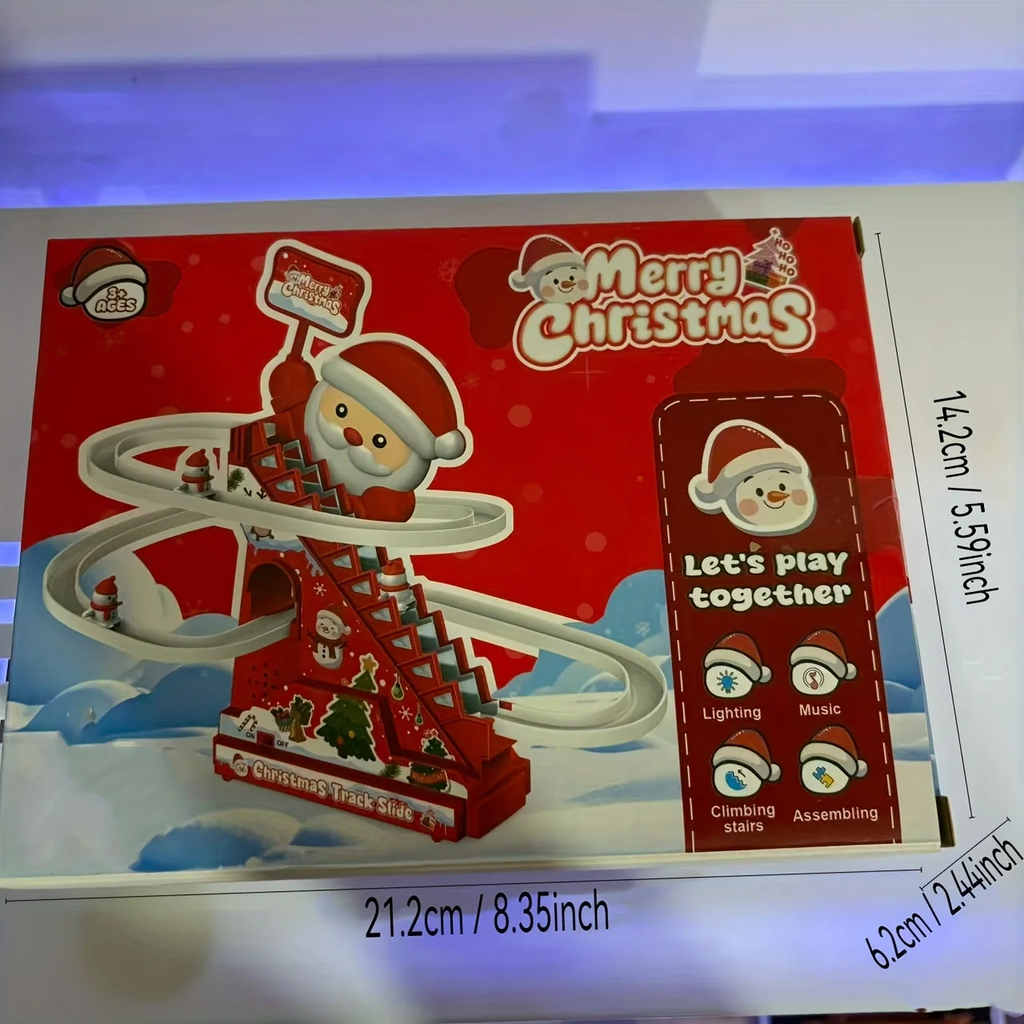 Box packaging for a Christmas-themed track set, featuring Santa Claus graphics, a red holiday design, and dimension markings showing 21.2cm by 14.