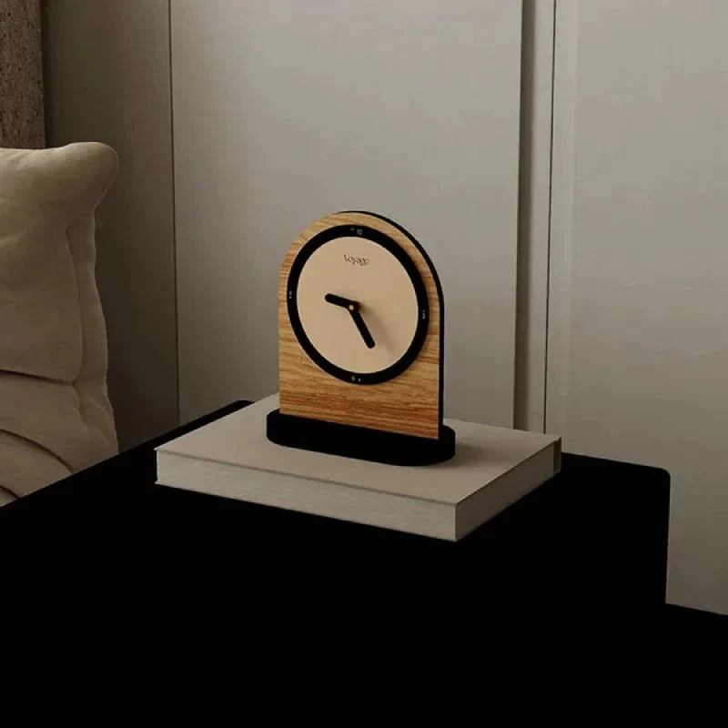 Wooden clock on a nightstand with a neutral background