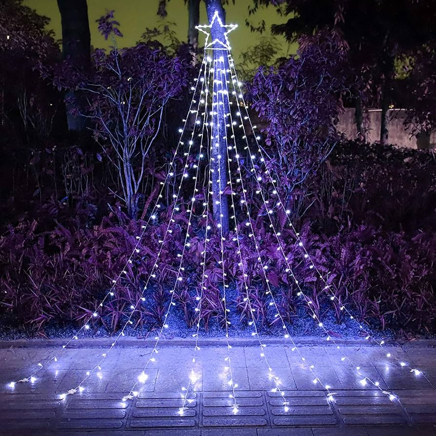 Decorative outdoor Christmas tree made of lights in a garden setting