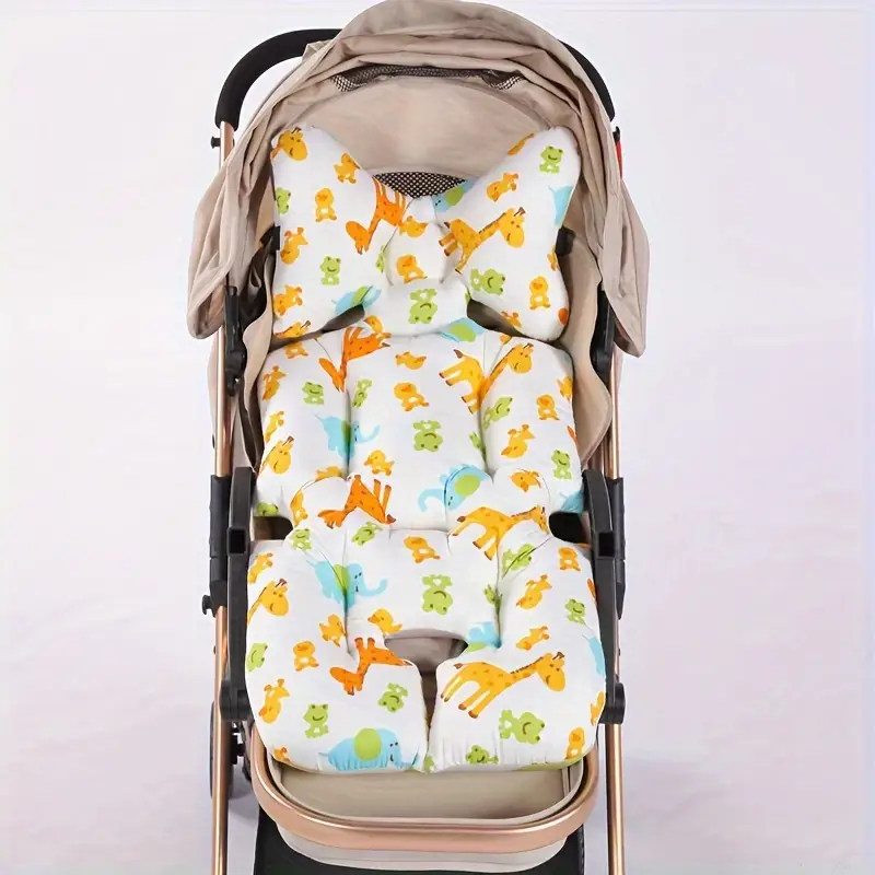 A padded baby stroller cushion set with a white background and a colorful cartoon animal print, shown installed inside a stroller against a plain light background.