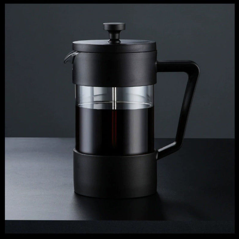 Black French press coffee maker on a dark background