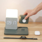 Smart home device with digital display on a wooden surface, hand interacting with it.