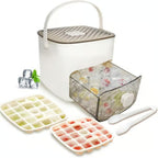 Ice cube tray set with freezer bag, ice cubes, and tongs on a white background
